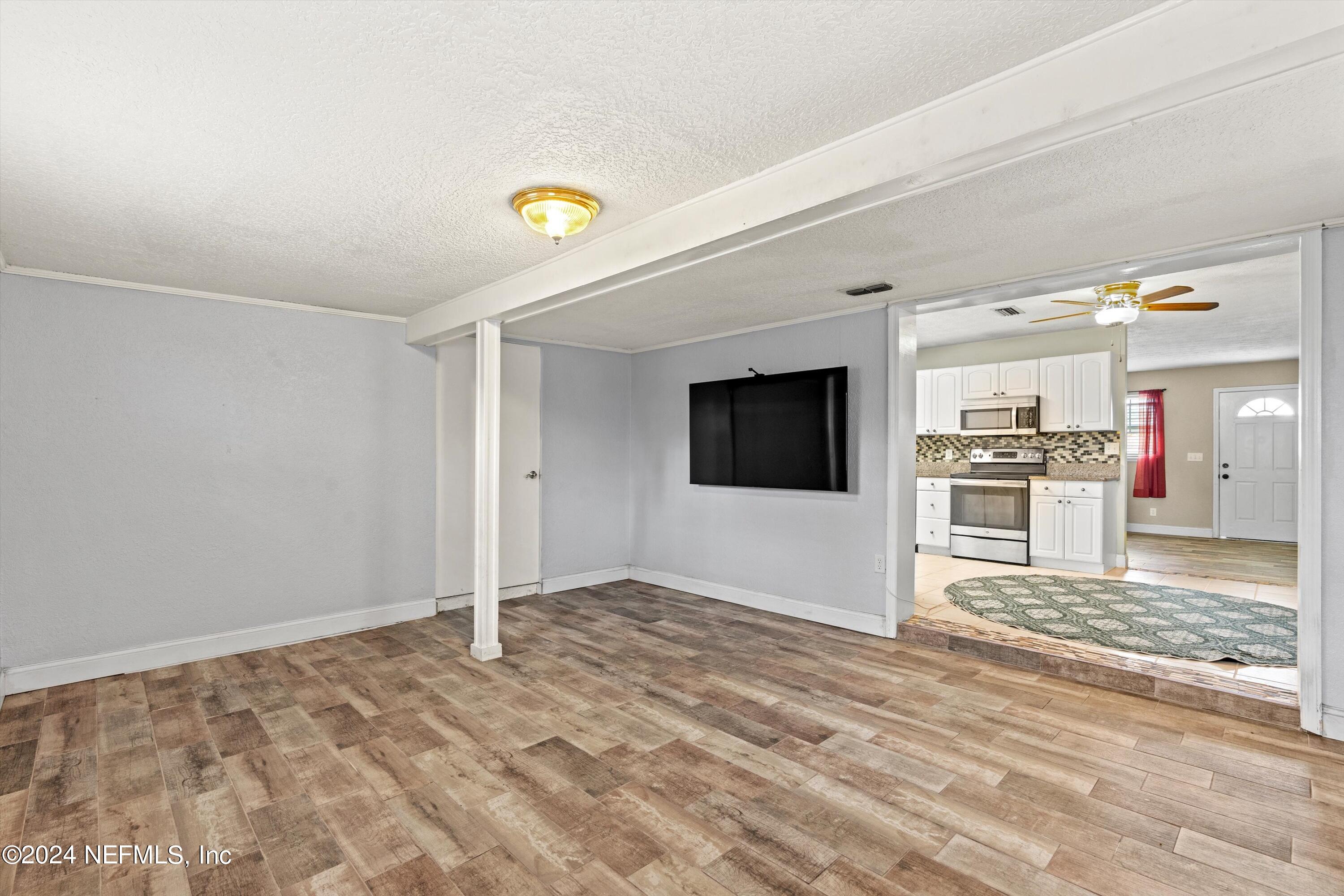 10750 Java Drive Jacksonville, FL 32246 - Photo 11 of 23 a view of a livingroom with wooden floor