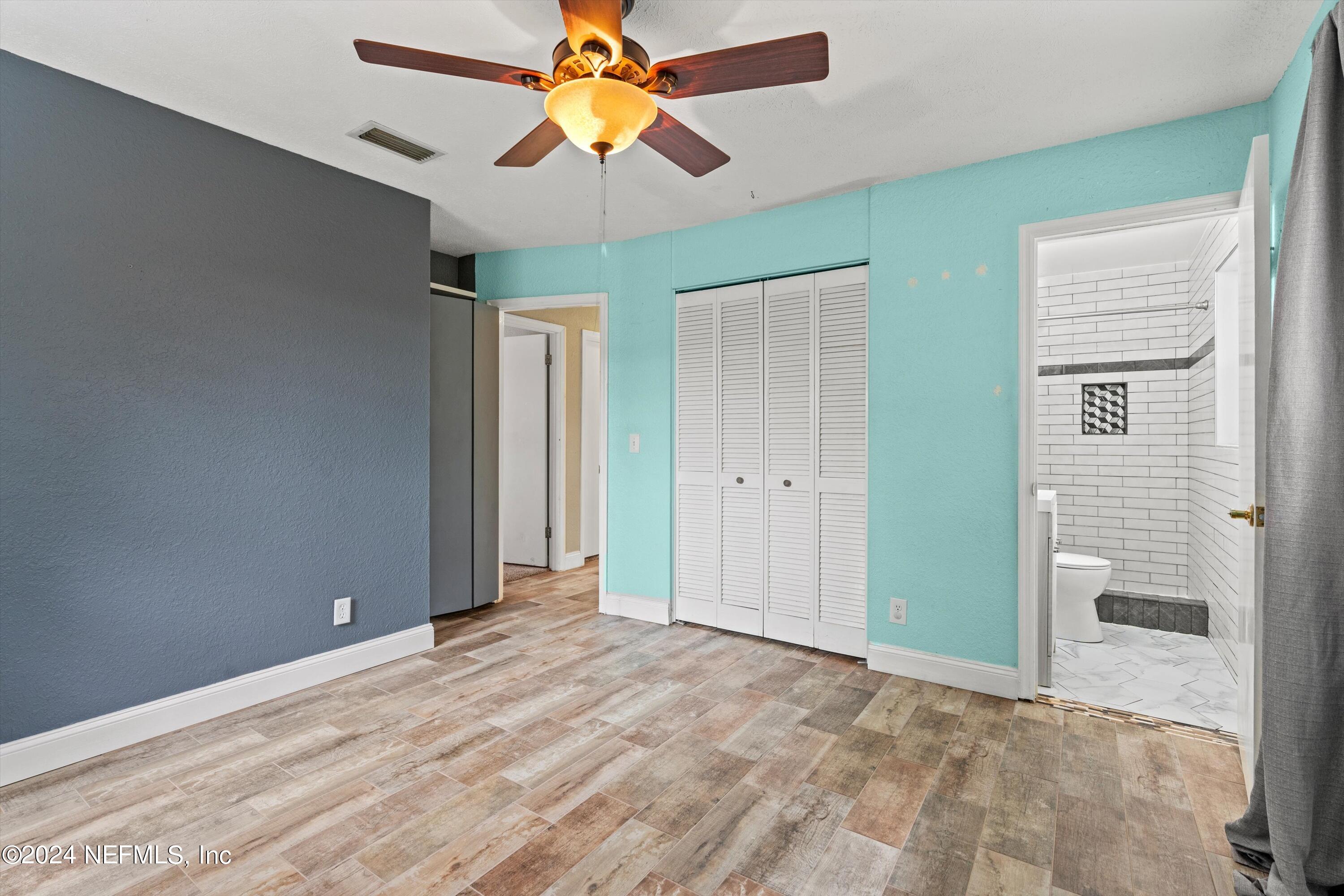 10750 Java Drive Jacksonville, FL 32246 - Photo 13 of 23 an empty room with a fan and a window