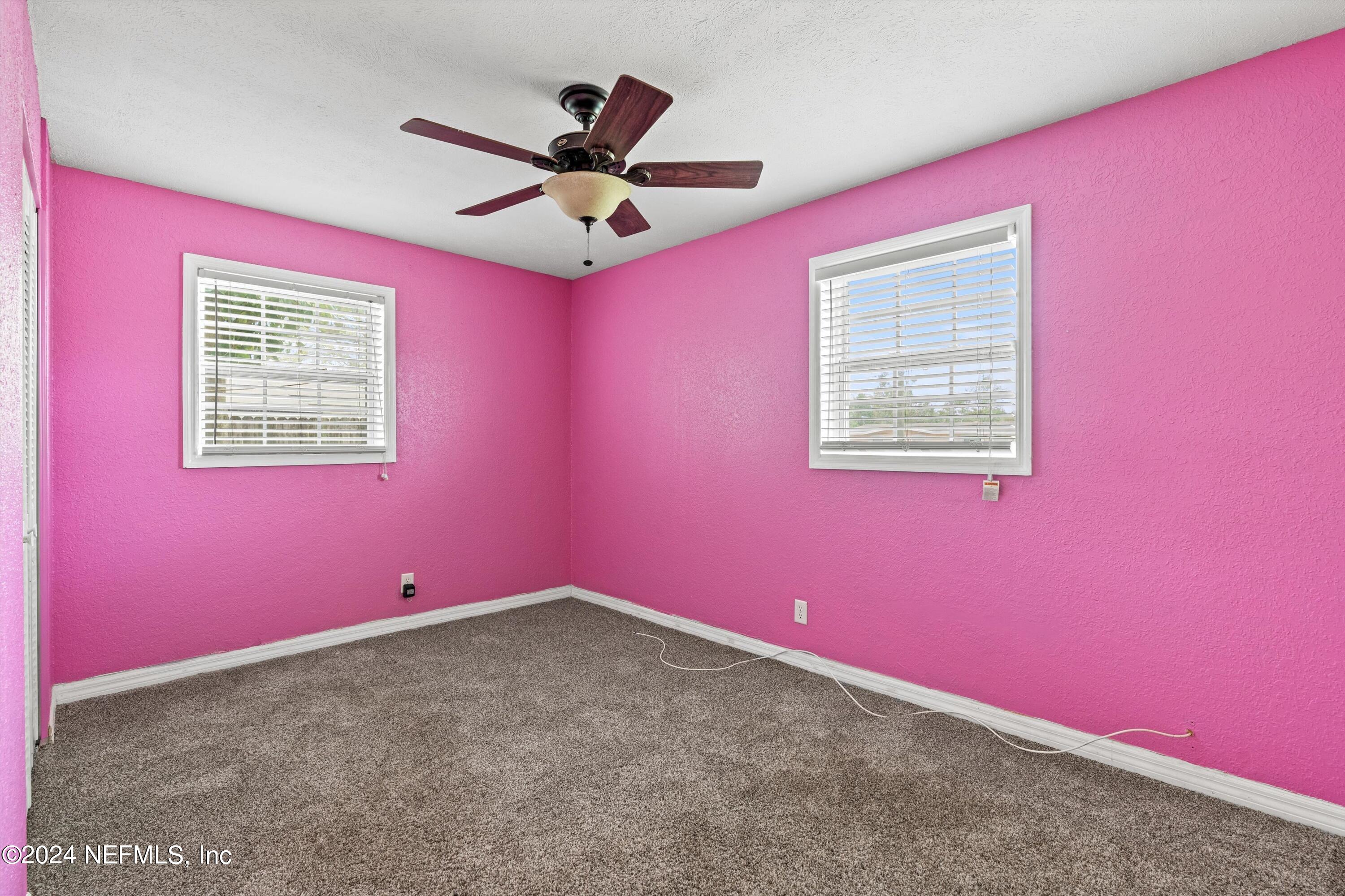 10750 Java Drive Jacksonville, FL 32246 - Photo 15 of 23 a view of a livingroom with an empty space and a ceiling fan