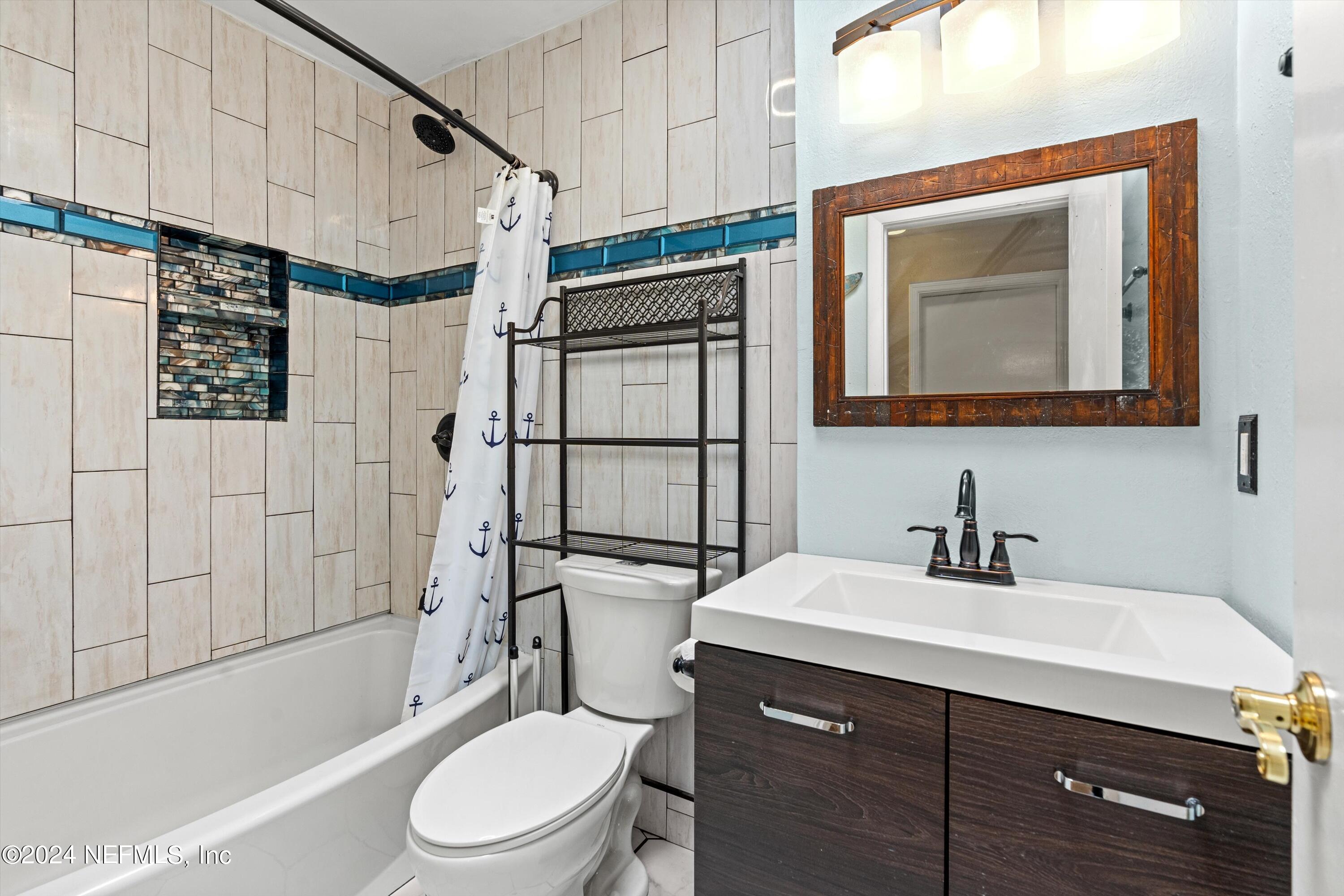 10750 Java Drive Jacksonville, FL 32246 - Photo 17 of 23 a white toilet sitting next to a bathroom sink