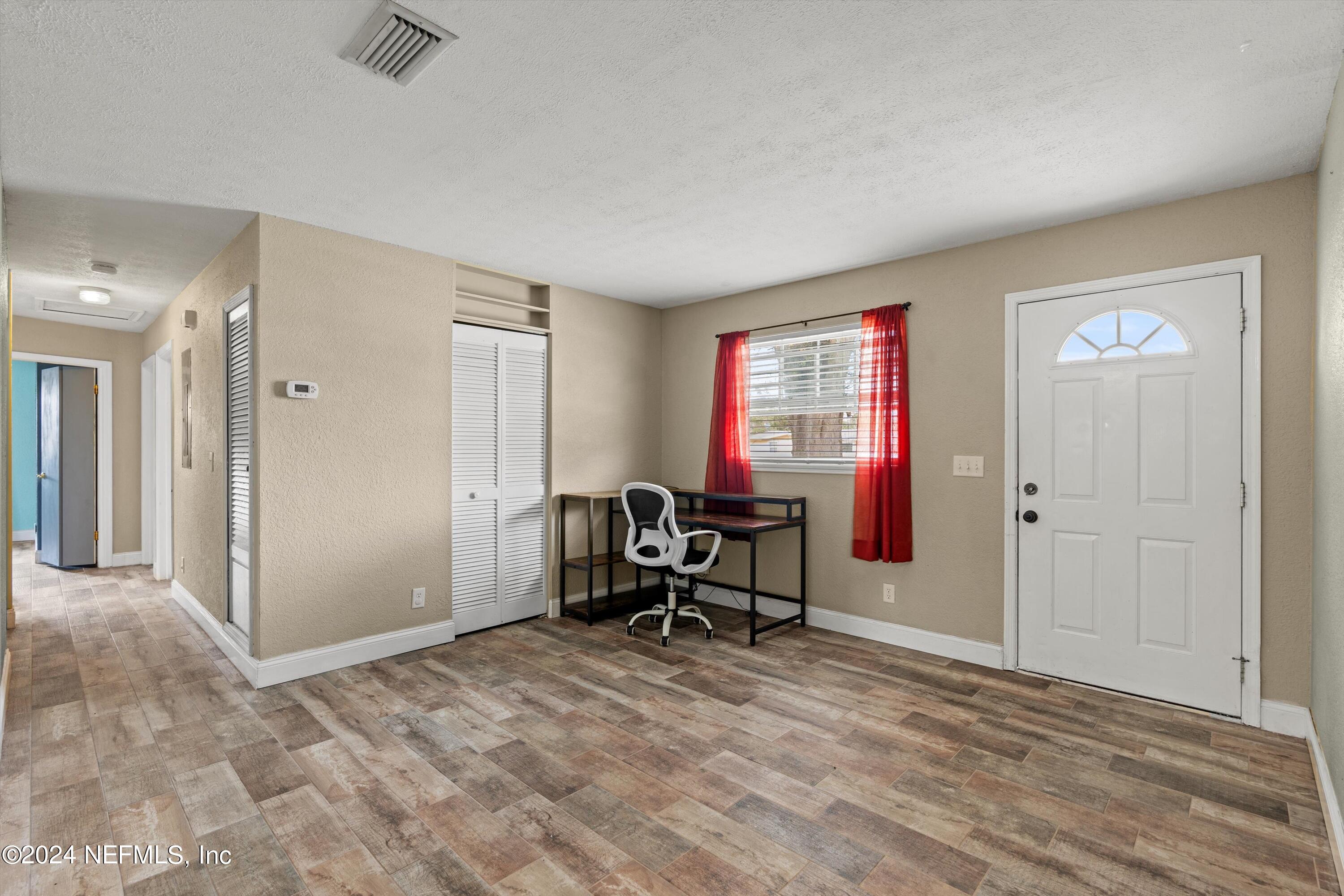 10750 Java Drive Jacksonville, FL 32246 - Photo 4 of 23 a view of a workspace with furniture and a window