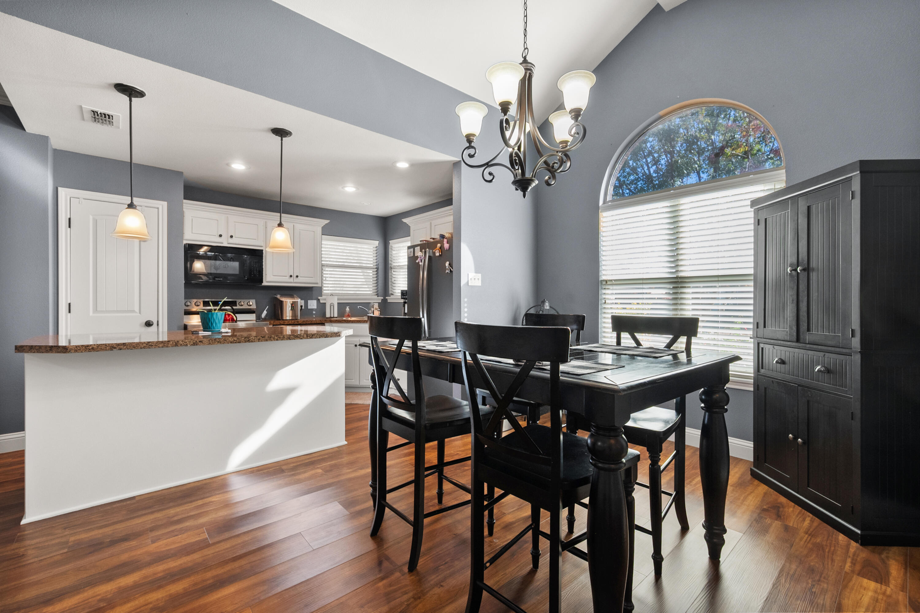5908 104th Street Lubbock, TX 79424 - Photo 15 of 33 a view of a dining room with furniture window and wooden floor