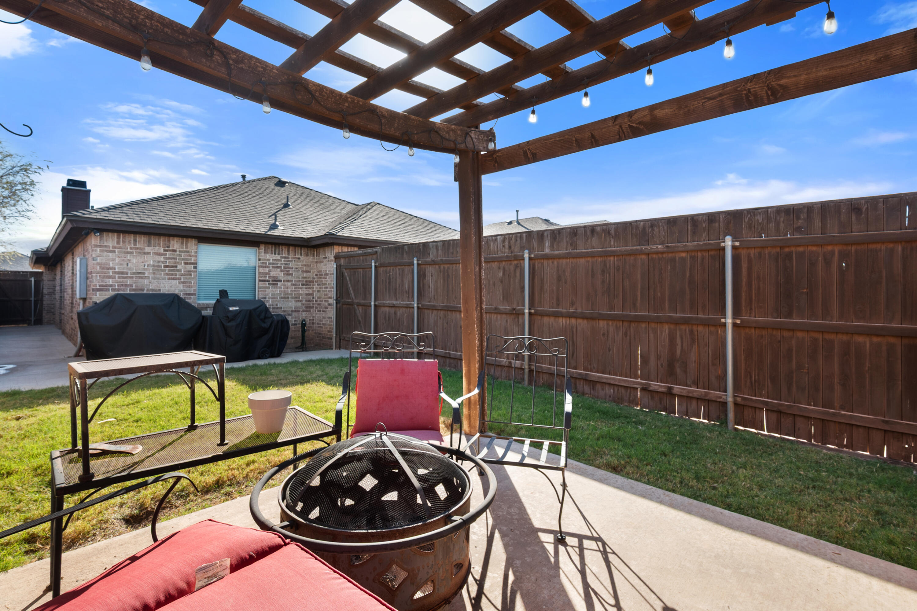 5908 104th Street Lubbock, TX 79424 - Photo 30 of 33 a view of a chairs and table in the patio