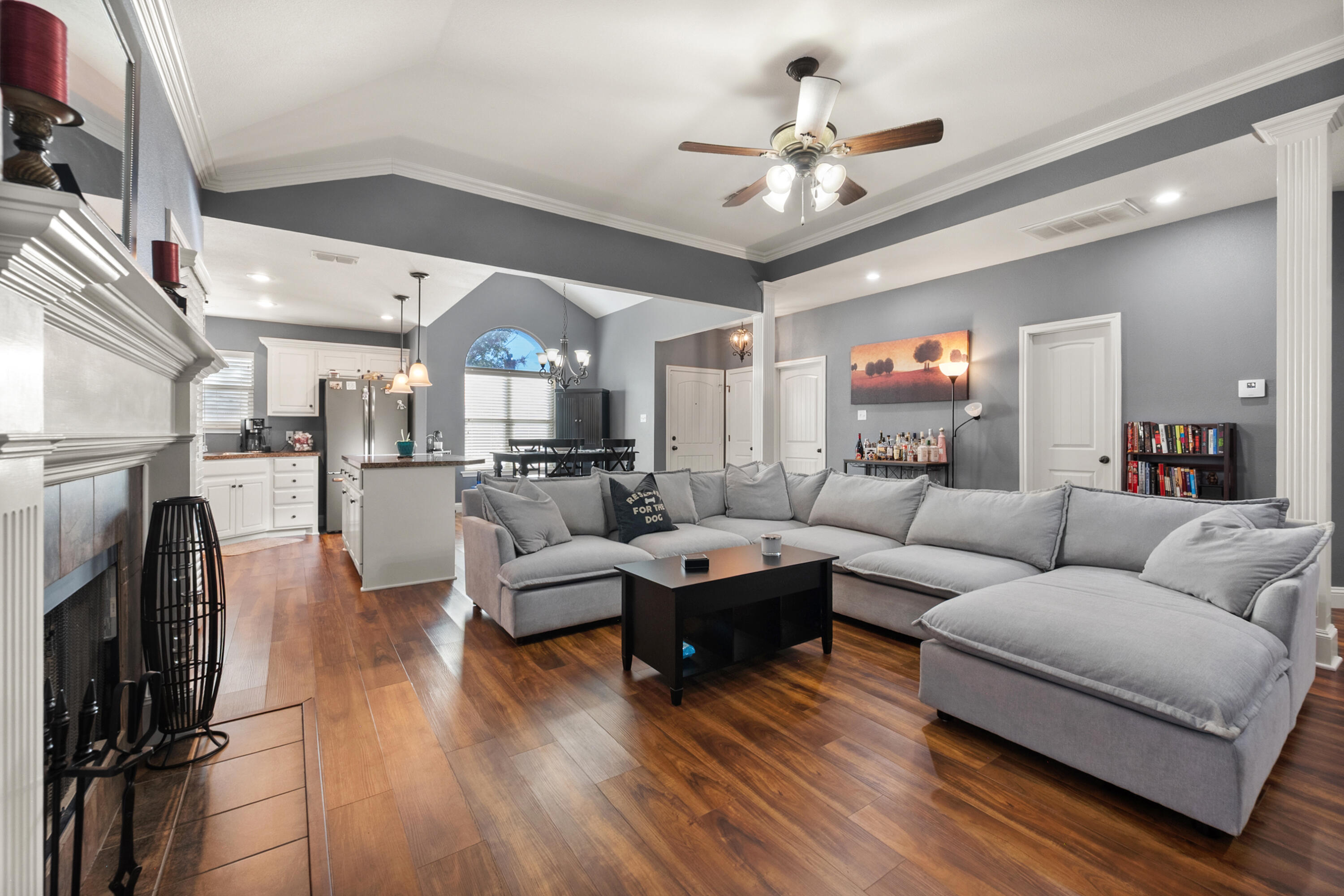 5908 104th Street Lubbock, TX 79424 - Photo 6 of 33 a living room with furniture fireplace and a chandelier