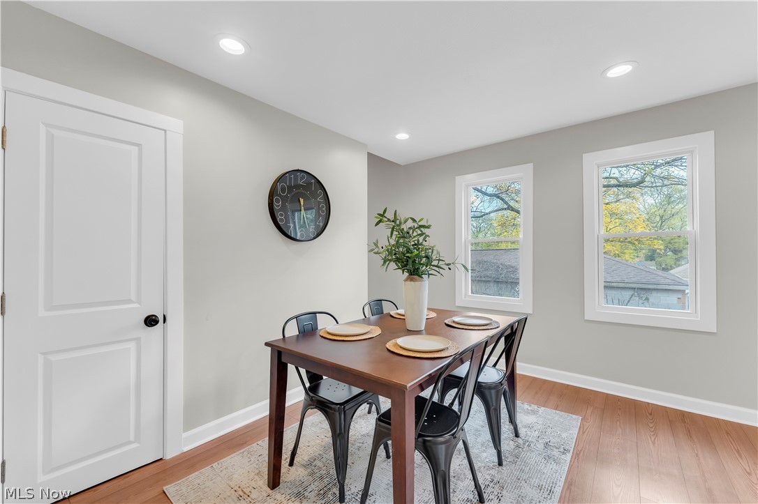 18155 Libby Road Maple Heights, OH 44137 - Photo 16 of 32 Dining area featuring wood-finish flooring, recessed lighting, and crisp white trim