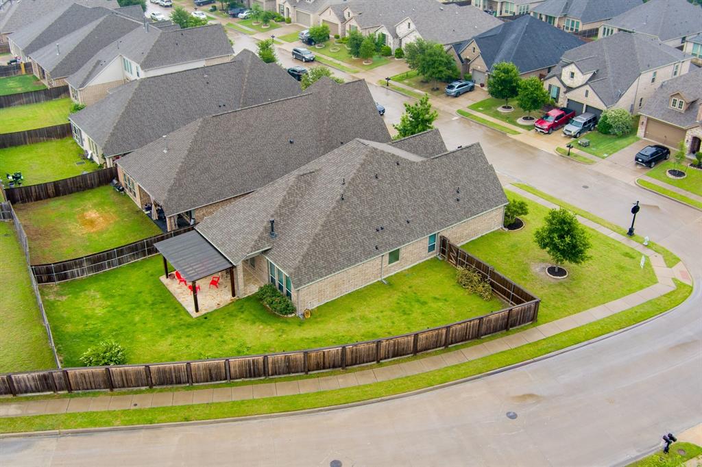 1501 Calcot Lane Forney, TX 75126 - Photo 30 of 34 Single-story residential property featuring a gray shingle roof and light brick exterior