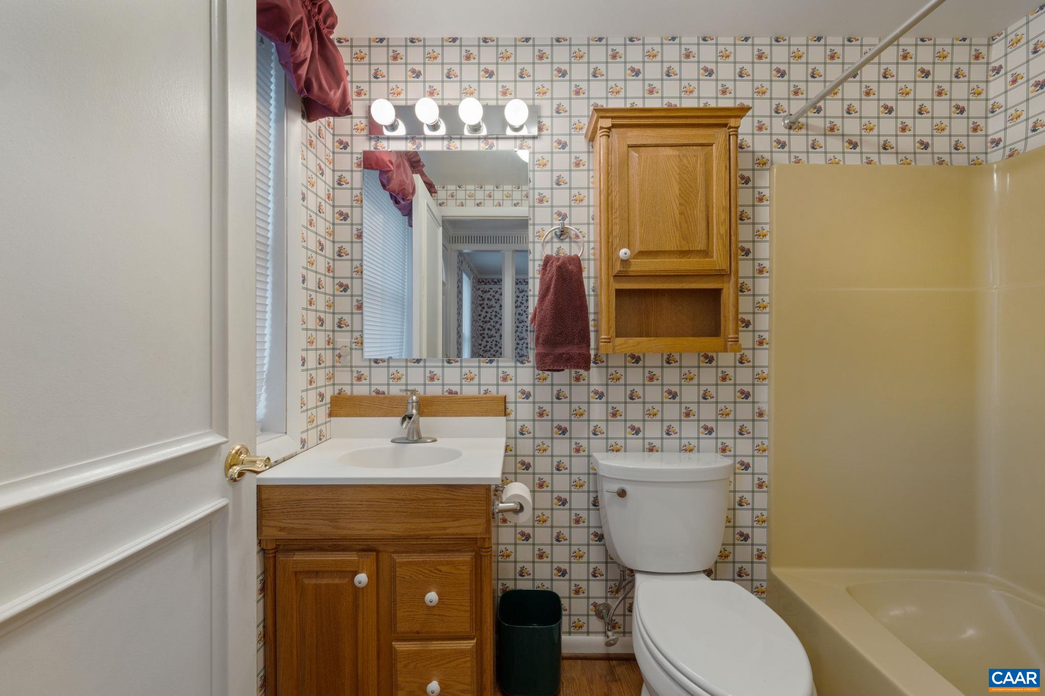 25 Amethyst Road Palmyra, VA 22963 - Photo 8 of 67 a bathroom with a granite countertop toilet sink and mirror
