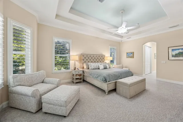 a living room with furniture a flat screen tv and a window