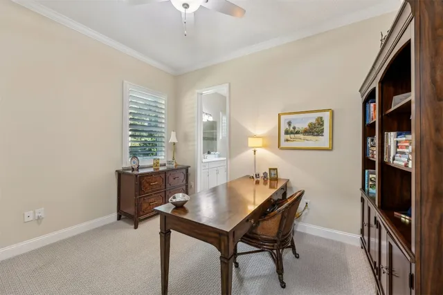 a kitchen with granite countertop a sink a stove and a refrigerator