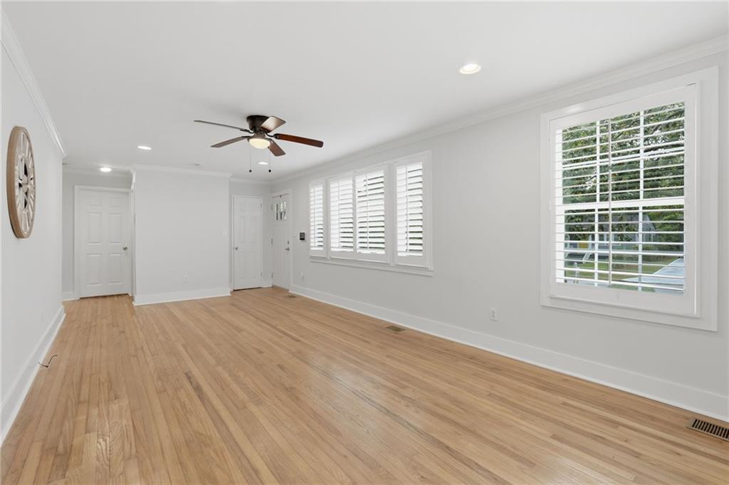 1222 Elizabeth Avenue Southwest Atlanta, GA 30310 - Photo 13 of 46 wooden floor in an empty room with a window