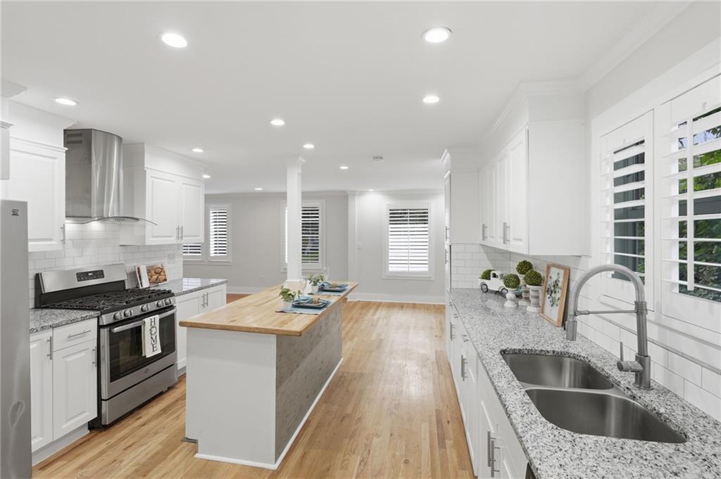 1222 Elizabeth Avenue Southwest Atlanta, GA 30310 - Photo 15 of 46 a kitchen with a sink stove top oven and microwave