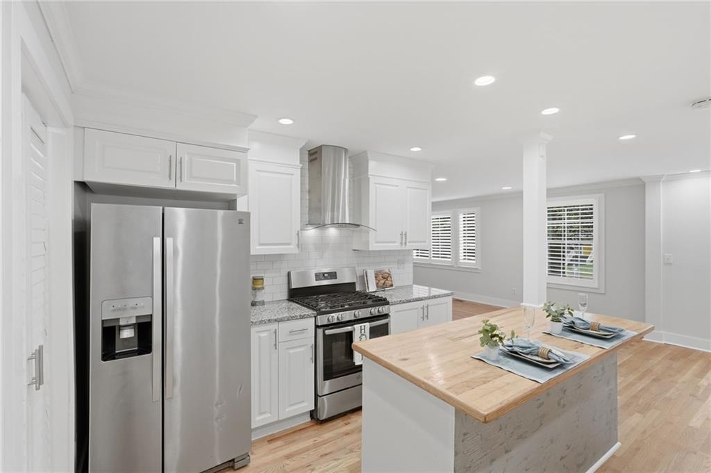 1222 Elizabeth Avenue Southwest Atlanta, GA 30310 - Photo 17 of 46 a kitchen that has a sink cabinets counter space and stainless steel appliances