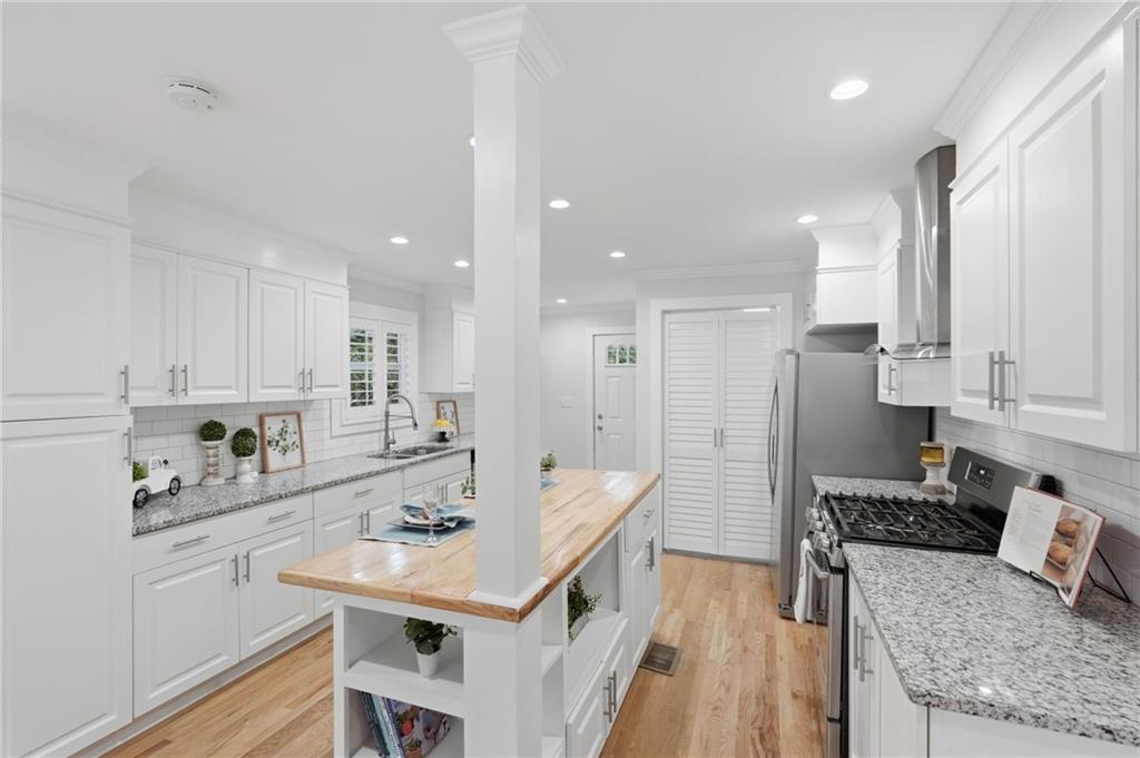 1222 Elizabeth Avenue Southwest Atlanta, GA 30310 - Photo 18 of 46 a kitchen with a sink stove and refrigerator