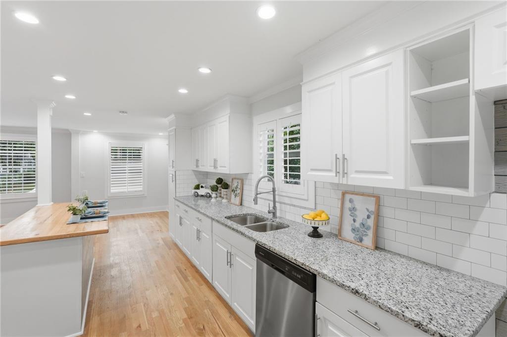 1222 Elizabeth Avenue Southwest Atlanta, GA 30310 - Photo 21 of 46 a kitchen with counter top space a sink appliances and cabinets