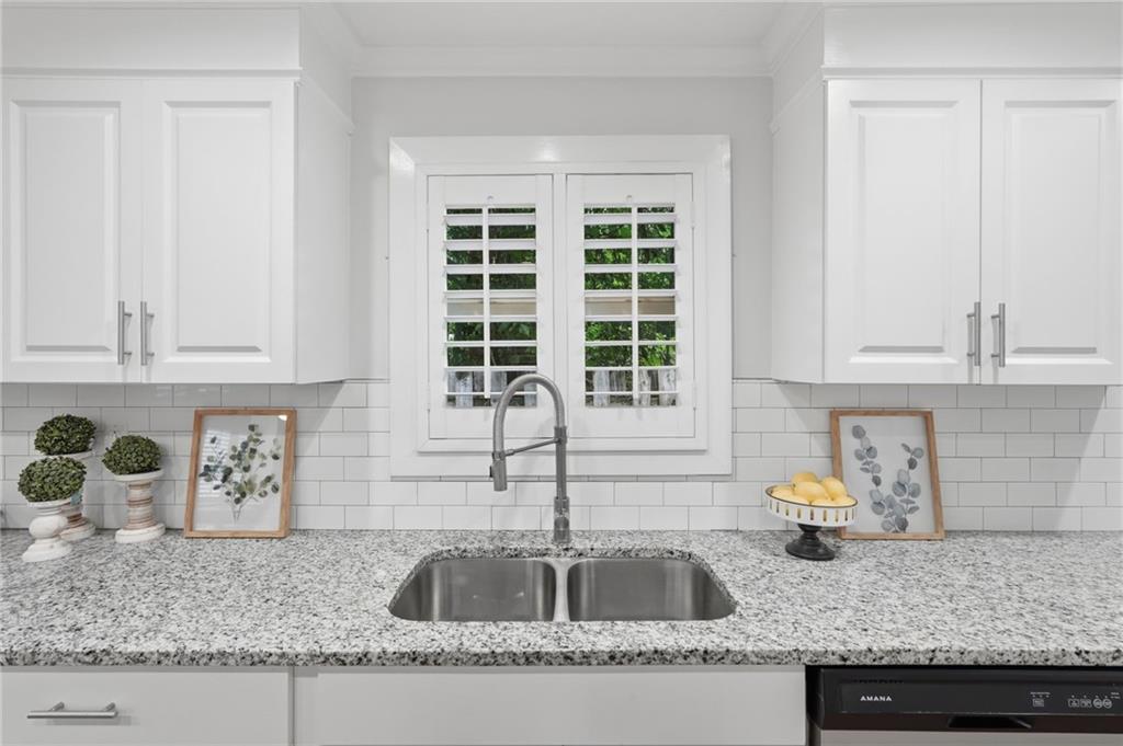 1222 Elizabeth Avenue Southwest Atlanta, GA 30310 - Photo 22 of 46 a kitchen with granite countertop a sink and a granite counter tops