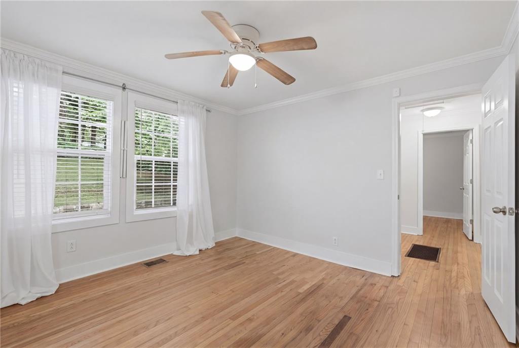 1222 Elizabeth Avenue Southwest Atlanta, GA 30310 - Photo 26 of 46 an empty room with wooden floor and windows