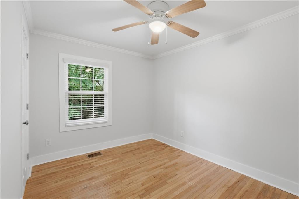 1222 Elizabeth Avenue Southwest Atlanta, GA 30310 - Photo 31 of 46 an empty room with a window and a fan
