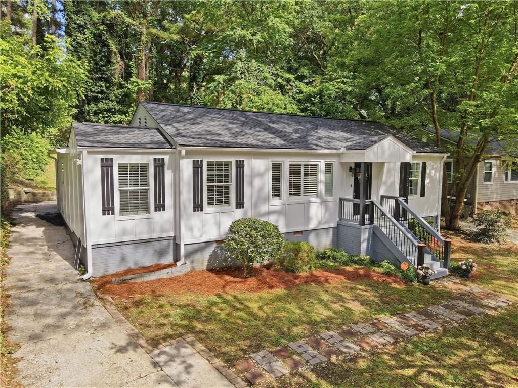 1222 Elizabeth Avenue Southwest Atlanta, GA 30310 - Photo 4 of 46 a front view of a house with a yard