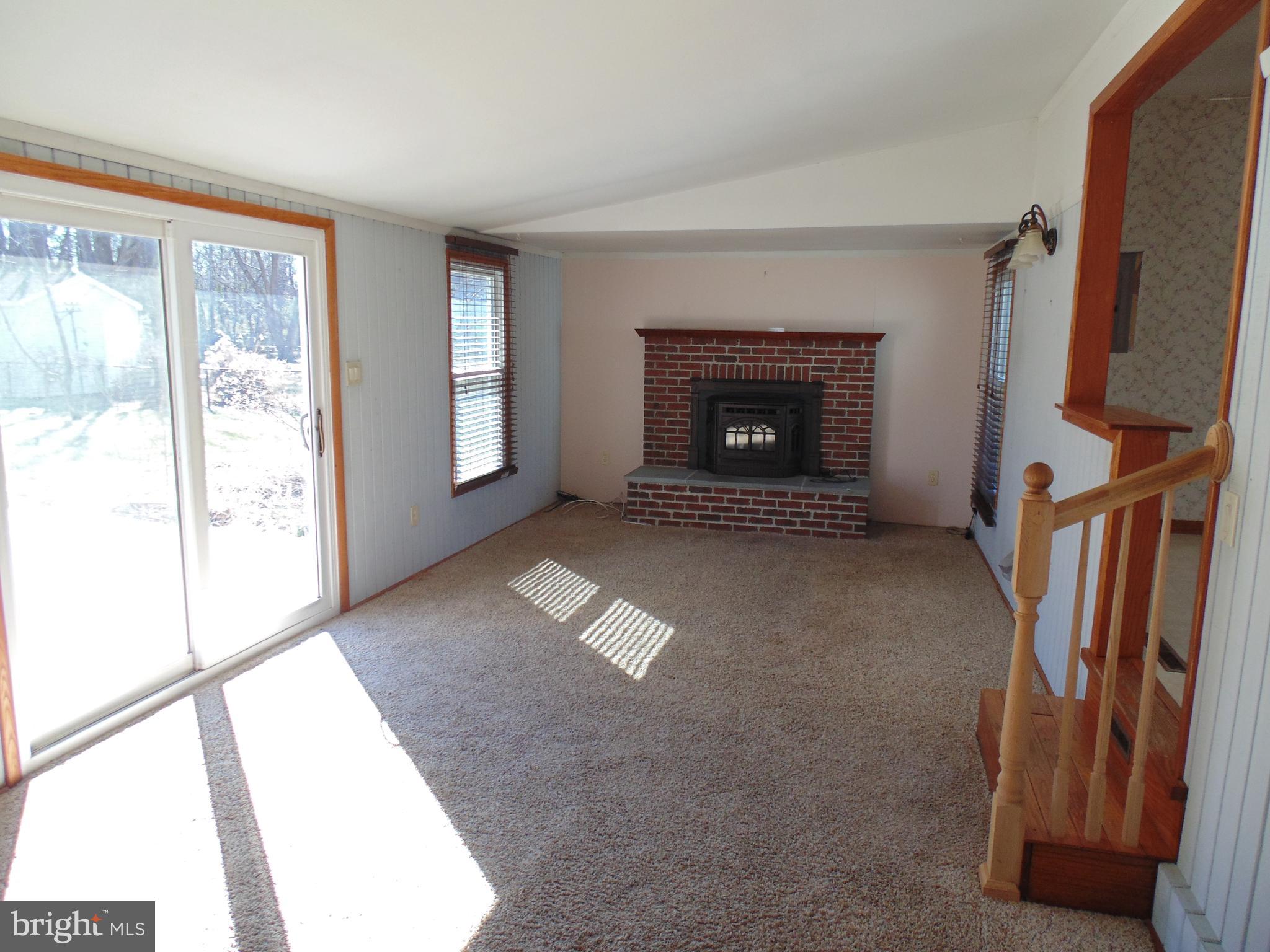 122 River Road Edgewater, MD 21037 - Photo 14 of 24 Family Room has Fireplace w/ Pellet Stove