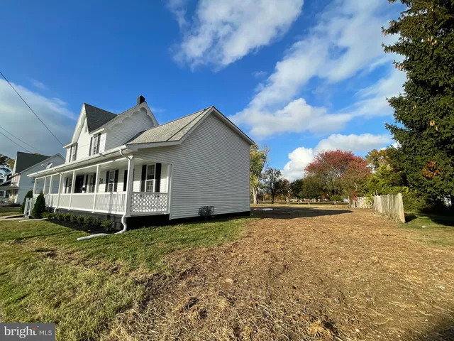 a living room with furniture rug and window