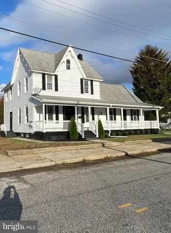 a front view of a house with a ocean view