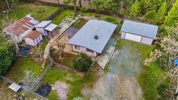 an aerial view of a house with a garden