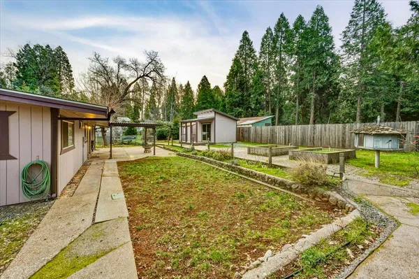 a view of a backyard with swimming pool