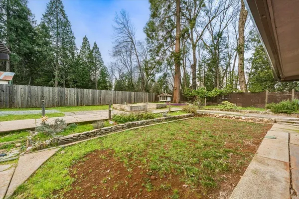 a view of a backyard with a small pool