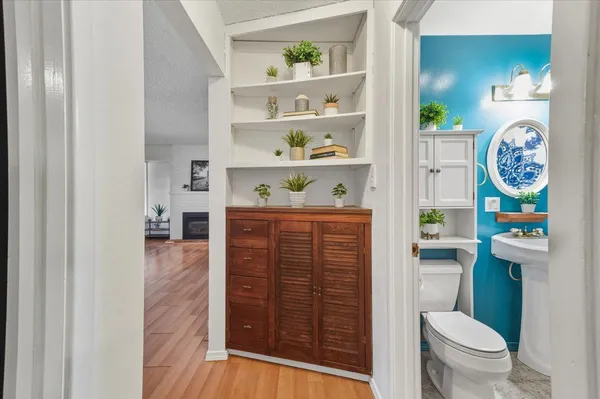 a bathroom with a toilet and a shower curtain
