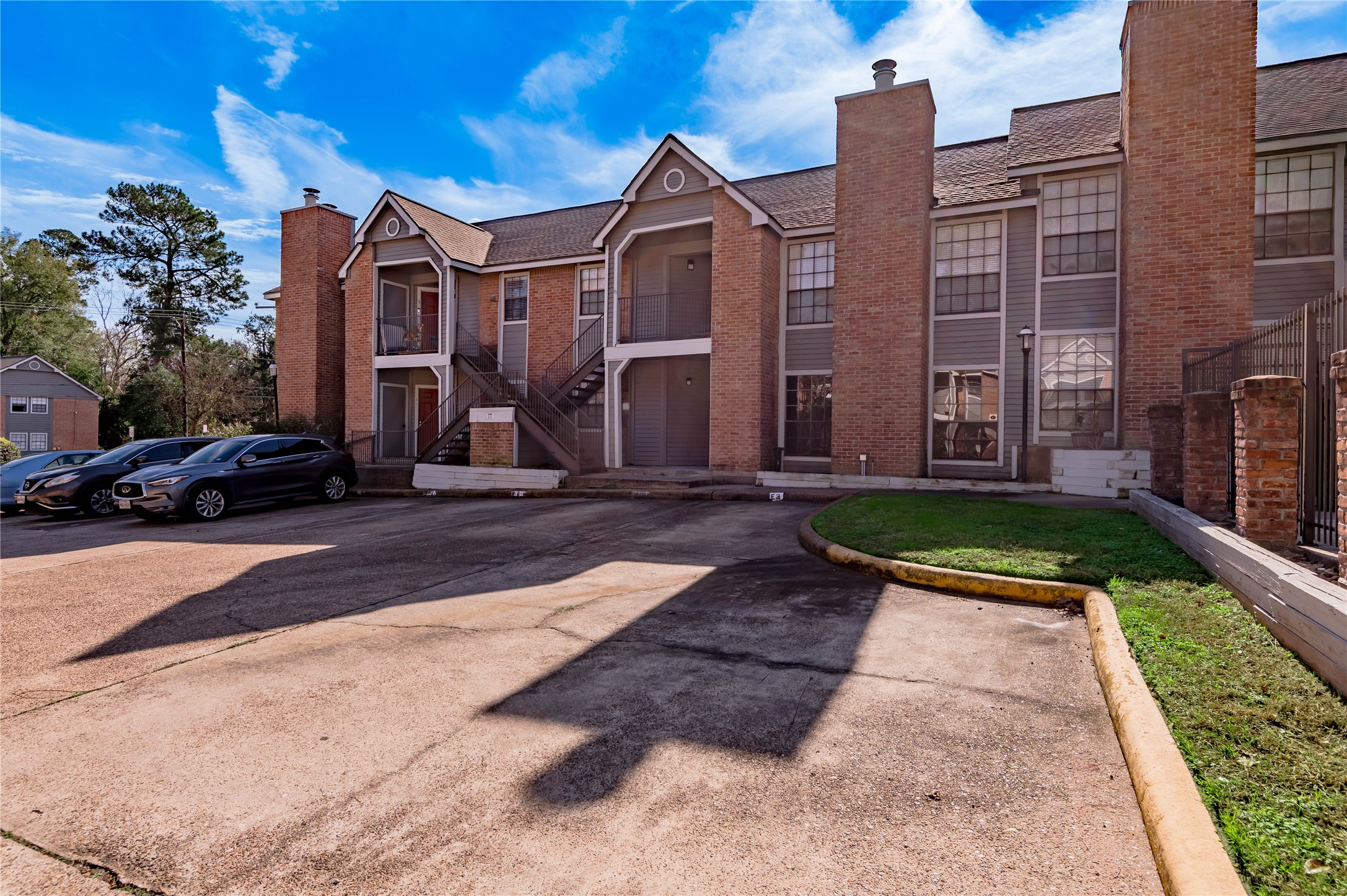 2402 Sycamore Avenue, Unit E2 Huntsville, TX 77340 - Photo 1 of 43 a view of a street in front of residential houses