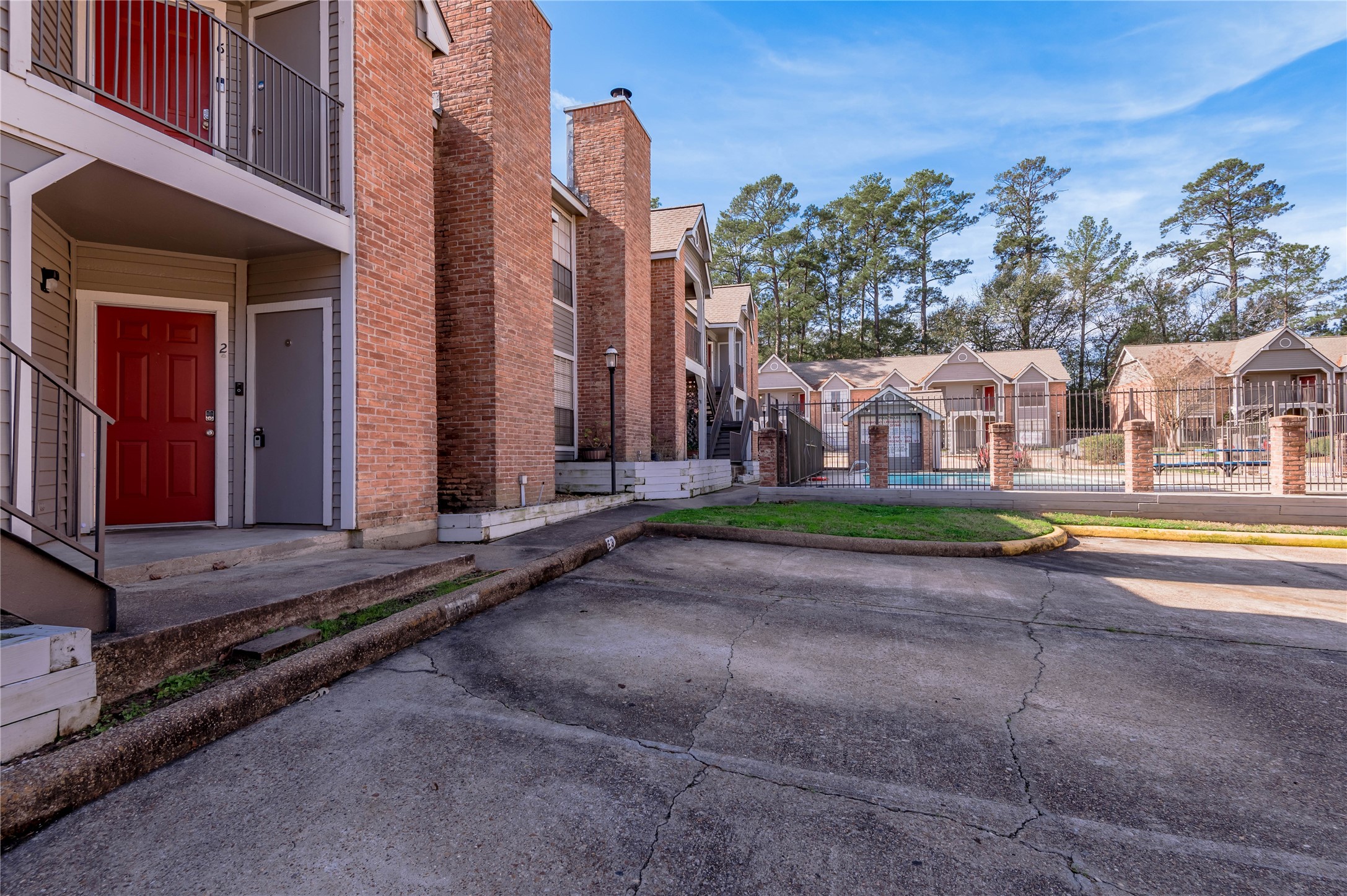 2402 Sycamore Avenue, Unit E2 Huntsville, TX 77340 - Photo 2 of 43 a view of a house with a swimming pool