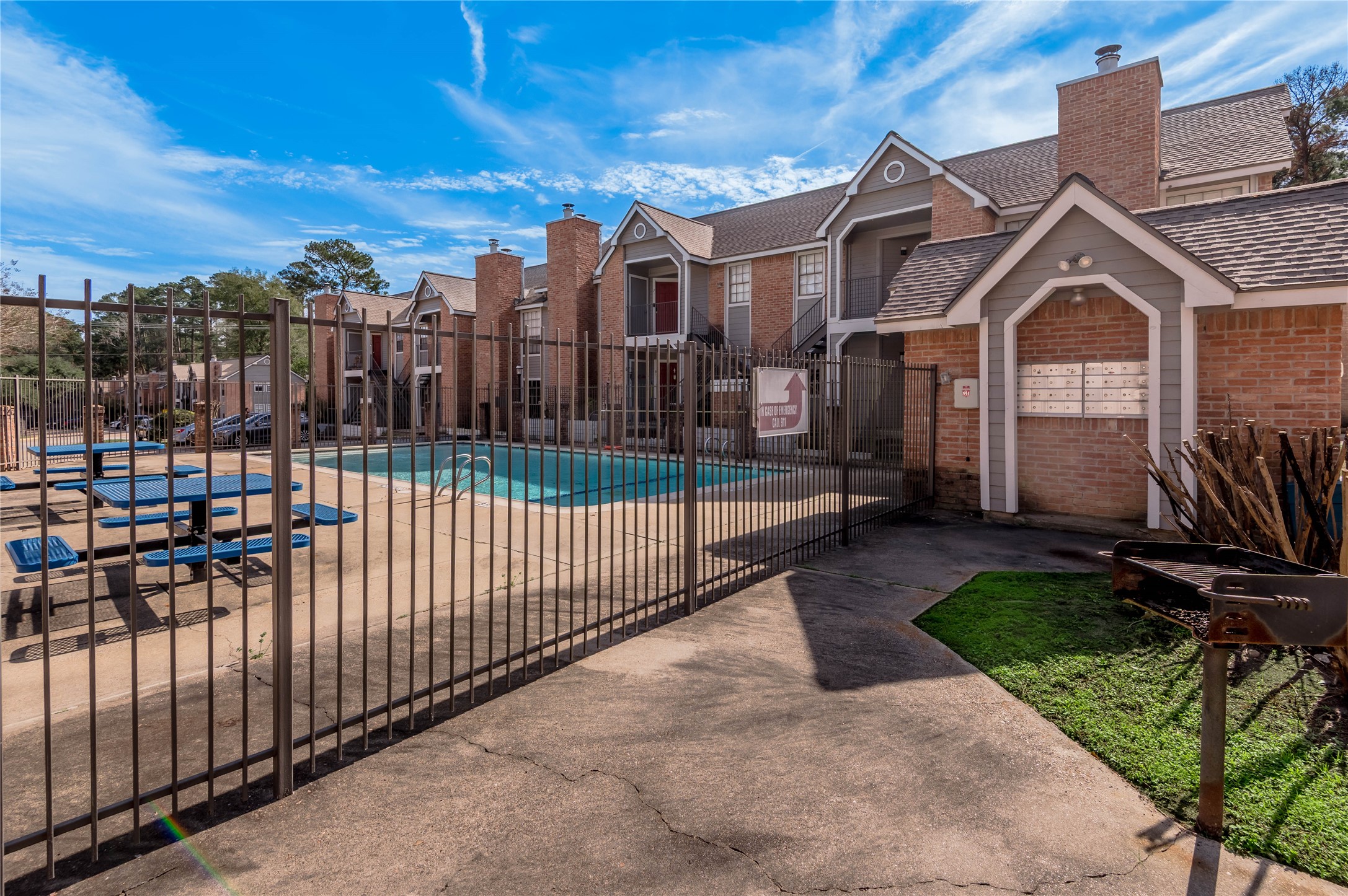 2402 Sycamore Avenue, Unit E2 Huntsville, TX 77340 - Photo 30 of 43 a view of a brick house with iron fence