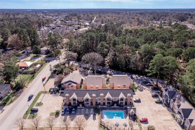 an aerial view of a house with a lake view