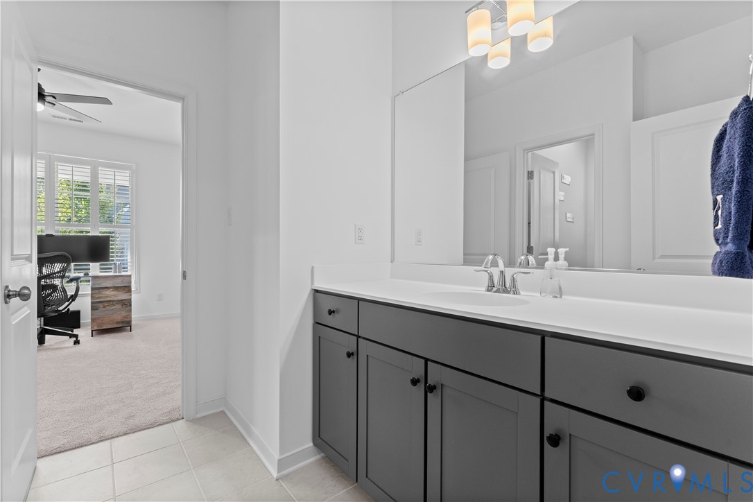 8819 Roberta Road Mechanicsville, VA 23116 - Photo 17 of 79 Contemporary vanity with dark cabinetry, integrate