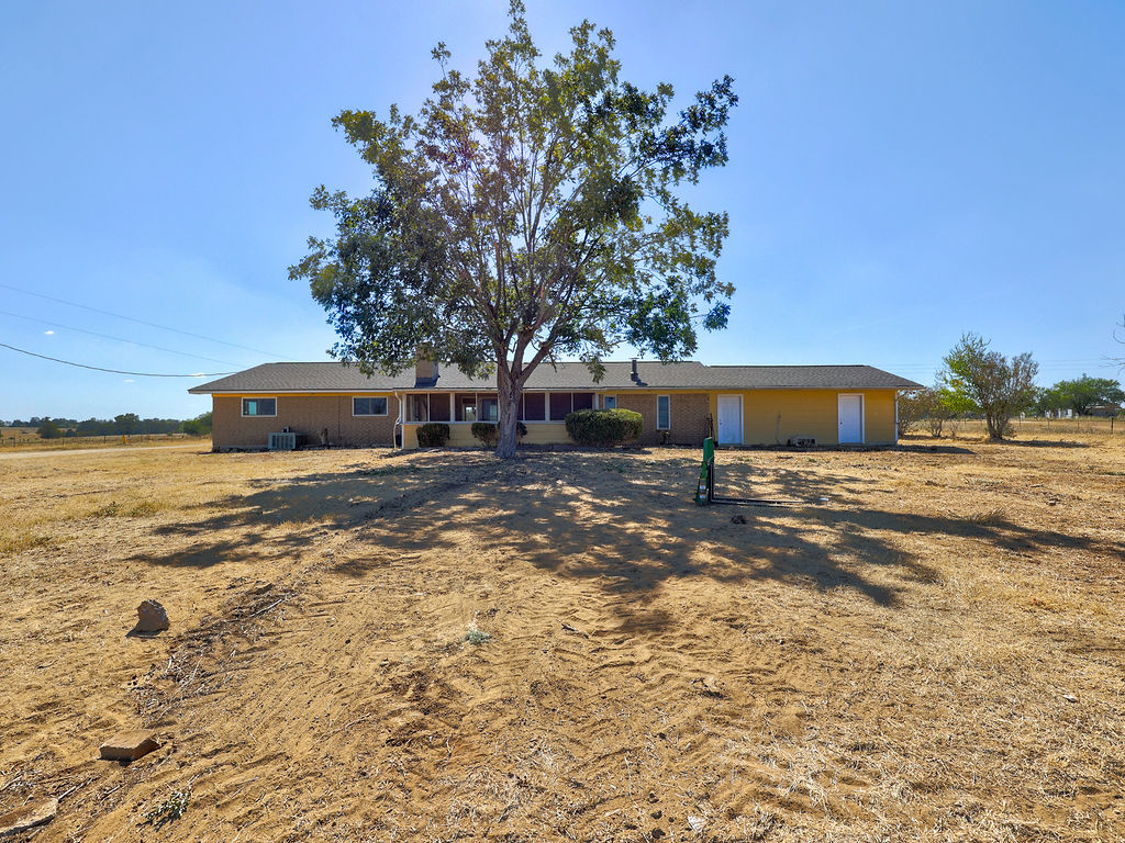5400 Gander Slough Road Kingsbury, TX 78638 - Photo 26 of 40 a front view of a house with a yard and trees