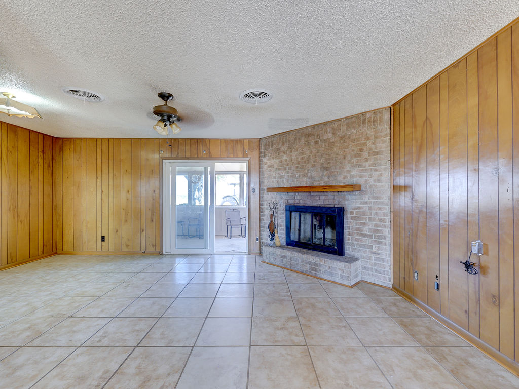 5400 Gander Slough Road Kingsbury, TX 78638 - Photo 27 of 40 View of dining area with fireplace as seen from entry foyer