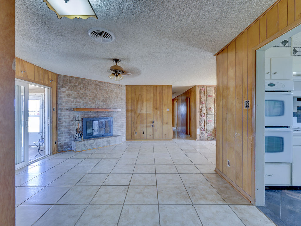 5400 Gander Slough Road Kingsbury, TX 78638 - Photo 28 of 40 a view of an empty room with a fireplace and a window