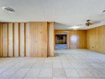 a kitchen with cabinets and window