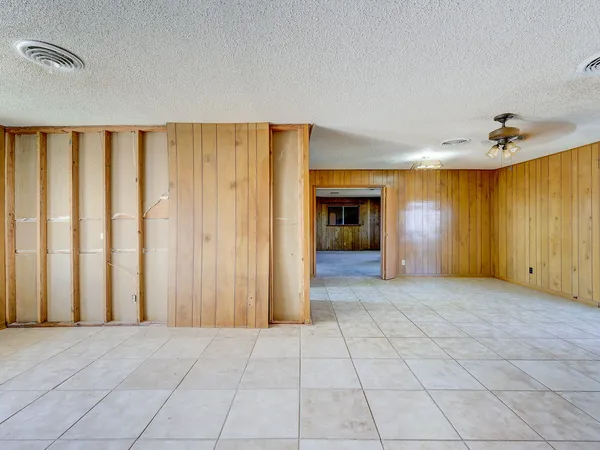 a kitchen with cabinets and window