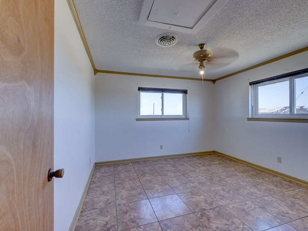 5400 Gander Slough Road Kingsbury, TX 78638 - Photo 38 of 40 a view of a big room with windows and chandelier fan