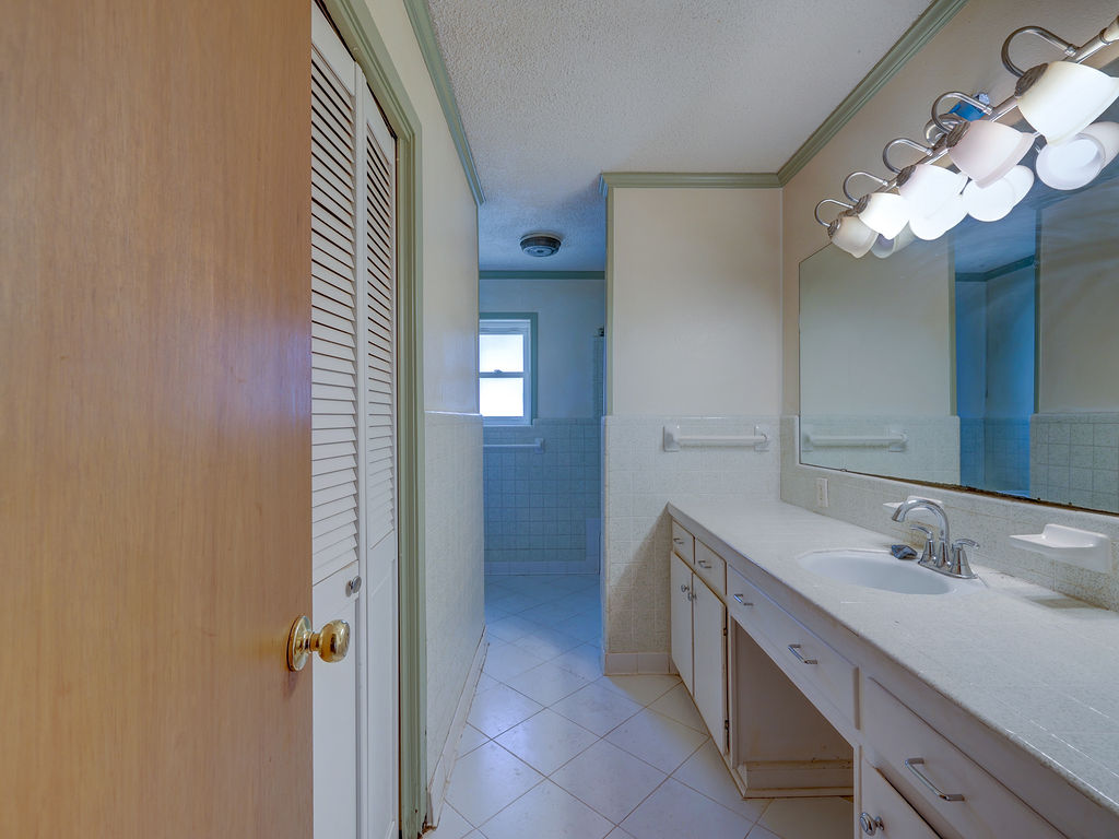 5400 Gander Slough Road Kingsbury, TX 78638 - Photo 39 of 40 a bathroom with a double vanity sink and a mirror