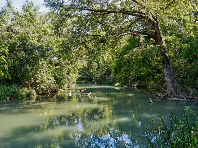 a view of lake with green space