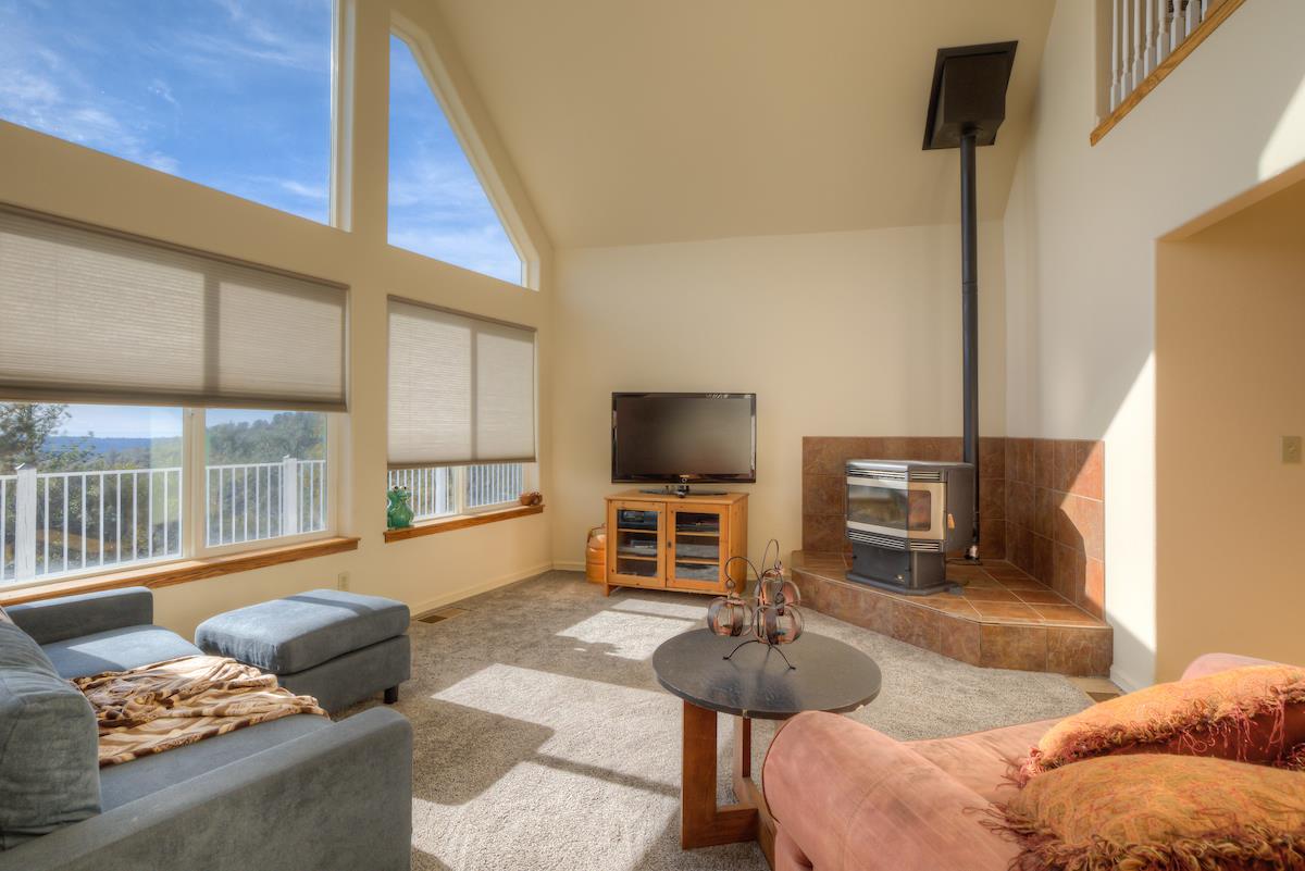 83 Northfork Road Berry Creek, CA 95916 - Photo 11 of 56 a living room with furniture and a flat screen tv