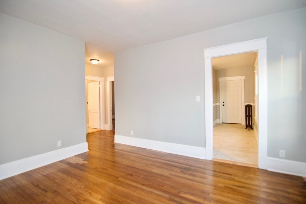81 Haskin Street Springfield, MA 01109 - Photo 17 of 39 a view of a room with wooden floor and a bathroom