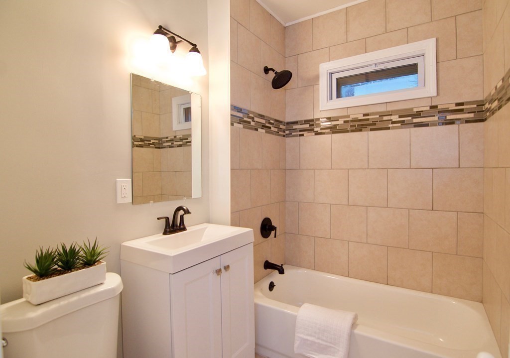 81 Haskin Street Springfield, MA 01109 - Photo 30 of 39 a bathroom with a sink a toilet a shower and bathtub