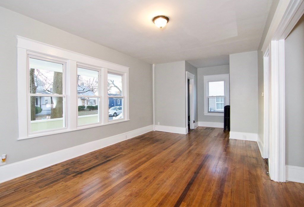 81 Haskin Street Springfield, MA 01109 - Photo 7 of 39 a view of empty room with wooden floor and fan