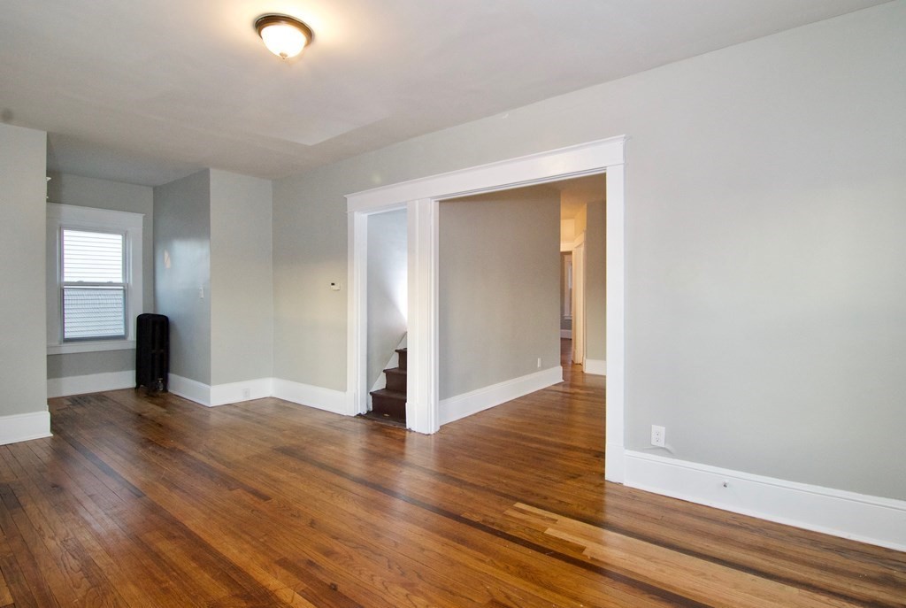 81 Haskin Street Springfield, MA 01109 - Photo 8 of 39 an empty room with wooden floor and closet