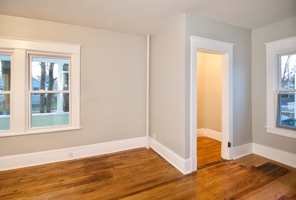 81 Haskin Street Springfield, MA 01109 - Photo 9 of 39 a view of an empty room with wooden floor and a window