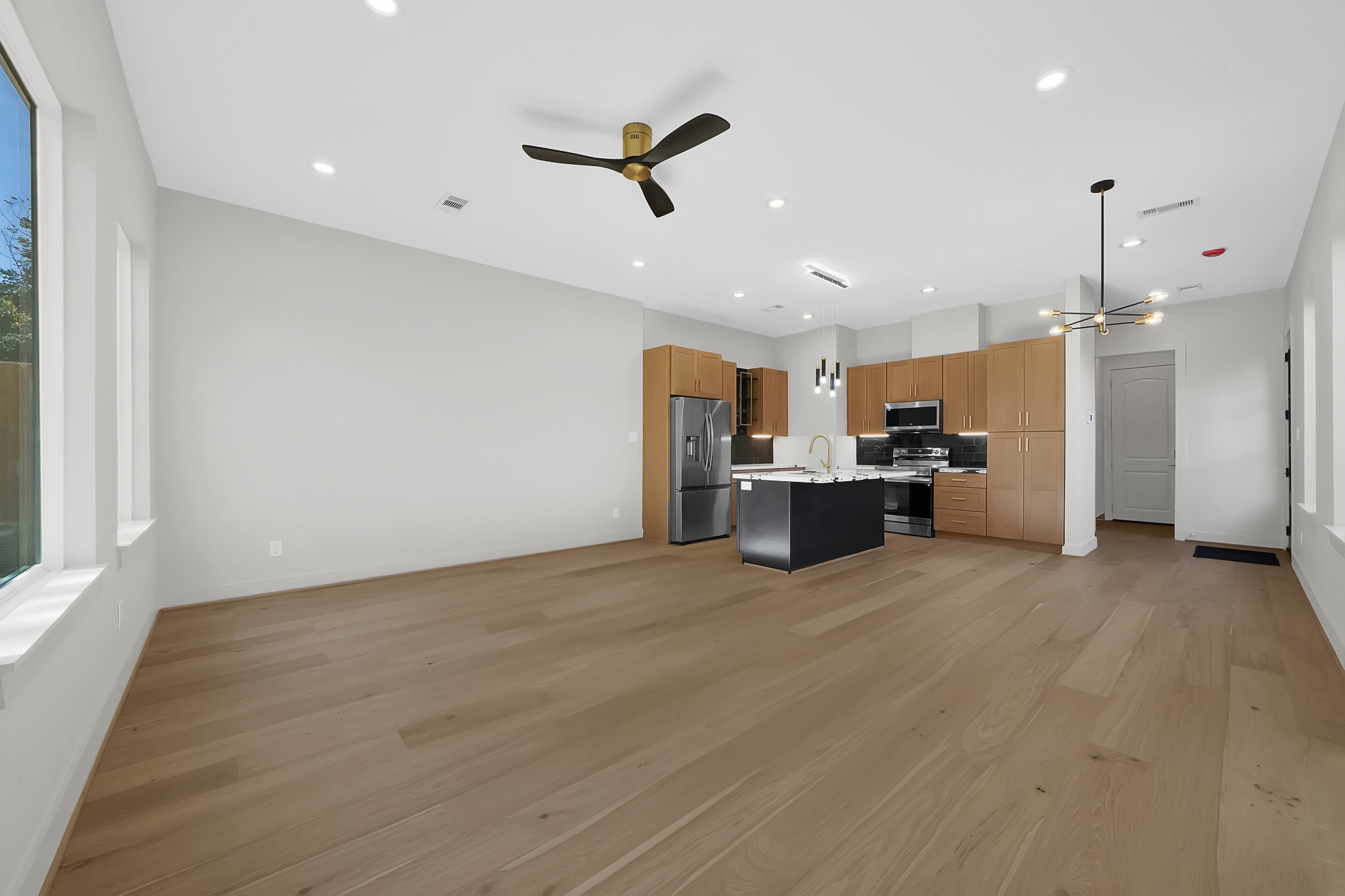 3630 Lydia Street Houston, TX 77021 - Photo 12 of 27 a view of a kitchen with a refrigerator and a sink