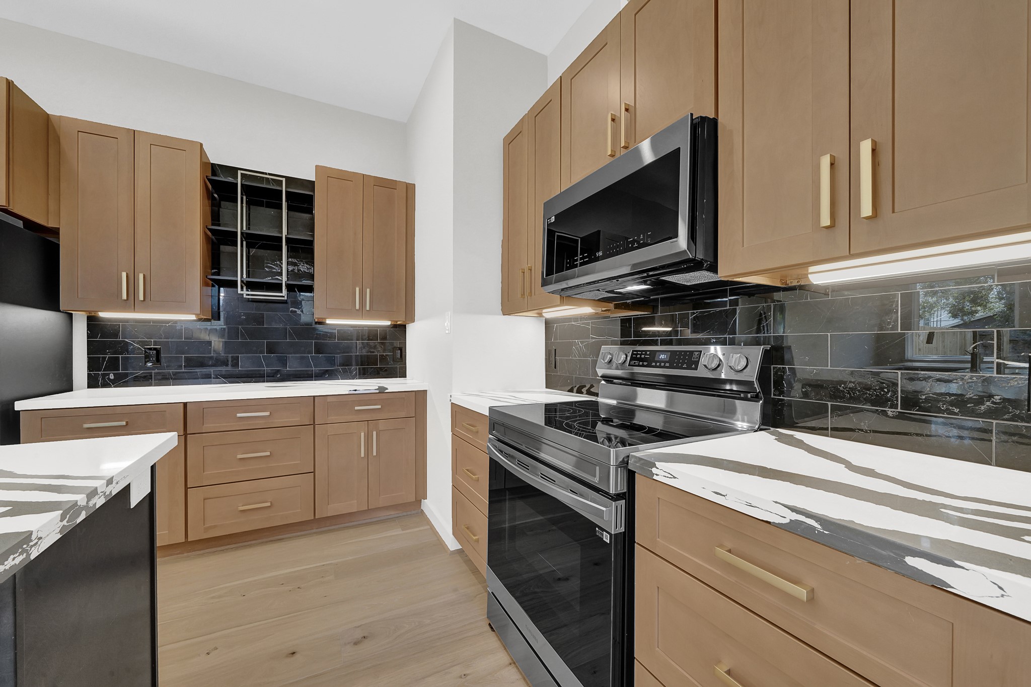 3630 Lydia Street Houston, TX 77021 - Photo 8 of 27 a kitchen with stainless steel appliances granite countertop a stove and a microwave